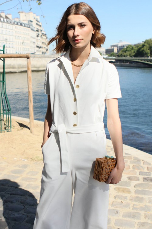 White jumpsuit with short sleeves and gold buttons 1